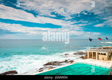 Bondi Beach open swimming pool with ocean on a bright day. Bondi beach is one of the most famous tourist locations in Australia Stock Photo