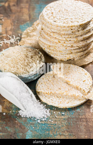 Healthy puffed rice cakes crackers stacked with sea salt close up Stock Photo