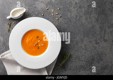 Pumkin soup with seeds and herbs Stock Photo