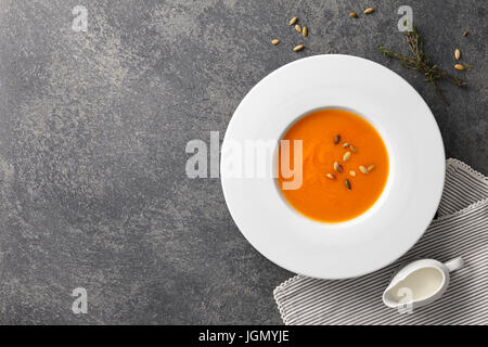 Pumkin soup with seeds and herbs Stock Photo