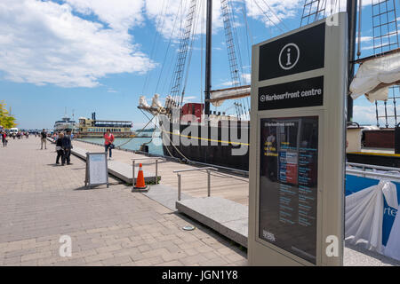 Toronto, Canada - 26 June 2017: The Harbourfront Centre sign with an old sailship in the background Stock Photo