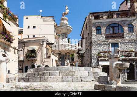 TAORMINA, ITALY - JUNE 29, 2017: baroque style fountain (Quattro Fontane di Taormina) on Piazza Del Duomo in summer day. Taormina is resort town on Io Stock Photo