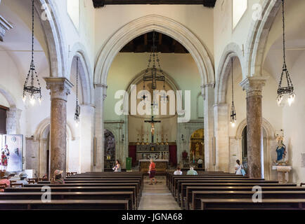 TAORMINA, ITALY - JUNE 29, 2017: visitors inside of Duomo di Taormina (Cathedral San Nicolo di Bari). The cathedral is dedicated to St Nicholas of Bar Stock Photo