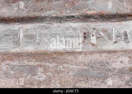 Word Iron is scratched on the rusty iron. View from above Stock Photo