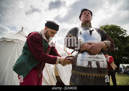London, Eltham, UK. 8th July, 2017. Knights suit up with battle armour to prepare for the Grand Medieval Joust at Eltham Palace © Guy Corbishley/Alamy Live News Stock Photo