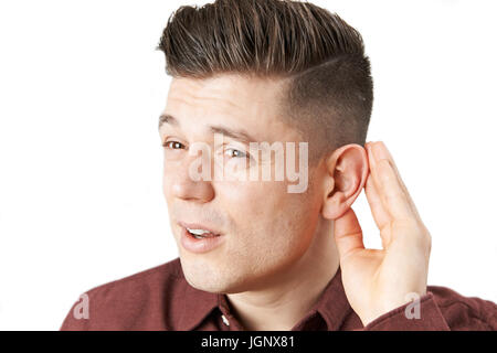 Young Man Suffering With Hearing Difficulties Stock Photo