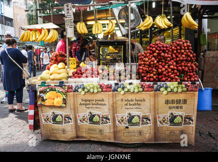 Kuala Lumpur, Malaysia - Jun 6, 2015. Selling fruits at the market in Chinatown, Kuala Lumpur, Malaysia. There are lots of budget hotels and cheap foo Stock Photo