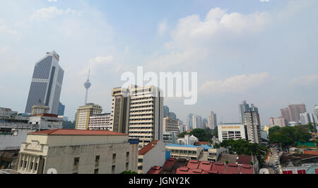 Kuala Lumpur, Malaysia - Jun 6, 2015. Buildings located at sunny day in Kuala Lumpur, Malaysia. Kuala Lumpur is the national capital of Malaysia as we Stock Photo