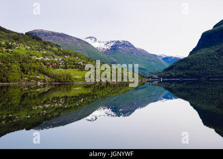 Reflections in calm waters of Nordfjorden Fjord on Norwegian west coast near Olden, Sogn og Fjordane county, Norway, Scandinavia, Europe Stock Photo