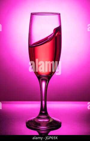 Splash of wine in a glass goblet Stock Photo