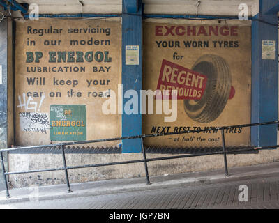 Old ghost signs for car parts in Soho, London Stock Photo