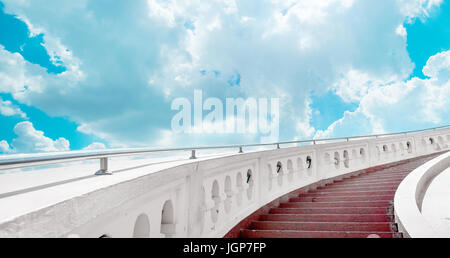 Stairs towards brifht blue sky with clouds Stock Photo
