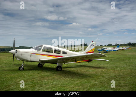 Single Engine Images a bright red single engine plane flying over Sag Harbor, NY Stock Photo ...
