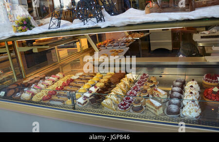 PARIS - AUG 11:  Pastries at the window of the Bretteau Jean-Marie Boulangerie and Patisserie in Paris, France are shown on August 11, 2016. Stock Photo