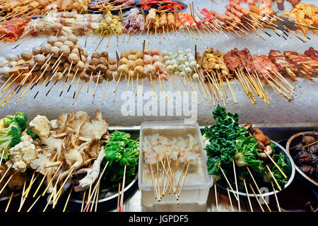 Lok-lok is a dish consisting of various deep-fried foods such as meats and vegetables that are served on a skewer. It is a street food found thoughout Stock Photo