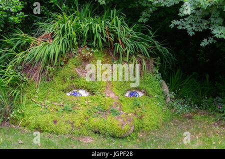 A human face made of plants and flowers in one of the English gardens. Stock Photo