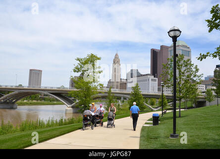 COLUMBUS, OH - JUNE 28: Walkers on the Scioto Mile in downtown Columbus, Ohio are shown on June 28, 2017. Stock Photo