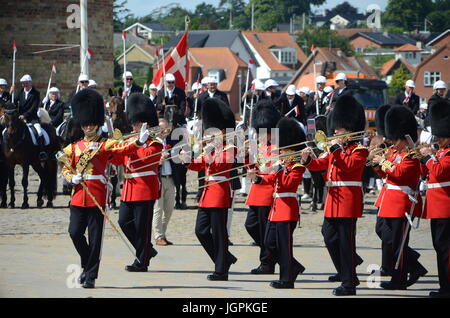 Sonderborg, Denmark - July 9, 2017: Band of the Irish Guards orchestra takes a sharp left turn to join in on the annual ring riding contest procession Stock Photo