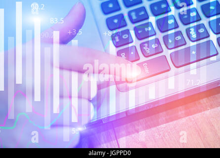 Double exposure stock financial on hand of business woman pointing Enter button on keyboard. Financial stock market economy analysis. Business people  Stock Photo