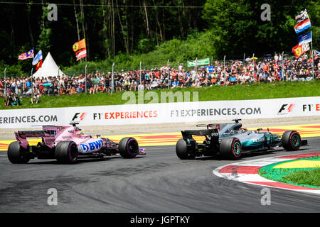 Spielberg, Austria. 09th July, 2017. Mercedes' British driver Lewis Hamilton overtakes Force India's Mexican driver Sergio Perez during the F1 Austrian Grand Prix race at the Red Bull Ring in Spielberg, Austria on July 9, 2017. Credit: Jure Makovec/Alamy Live News Stock Photo