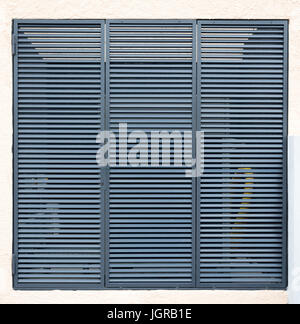 Square metal ventilation grille on a white wall Stock Photo