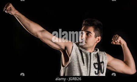 Man practicing stretching, archery, or some type of recreational activity Stock Photo