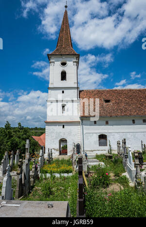 Holy Trinity Church and cemetery in small village of Sibiel famous from traditional Saxon architecture in Saliste commune, Transylvania in Romania Stock Photo