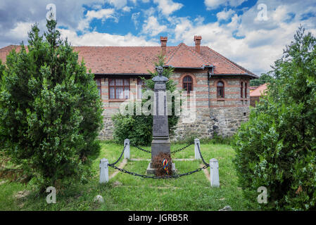 Monument of Romanian heroes in front of general school in small village of Sibiel famous from traditional Saxon architecture, Transylvania, Romania Stock Photo