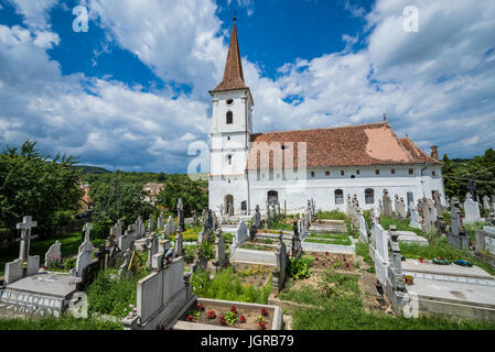 Holy Trinity Church and cemetery in small village of Sibiel famous from traditional Saxon architecture in Saliste commune, Transylvania in Romania Stock Photo