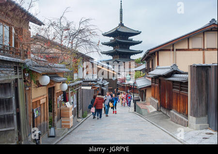 Kyoto, Japan - Tourists walking on a street leading to Yasaka pagoda Stock Photo