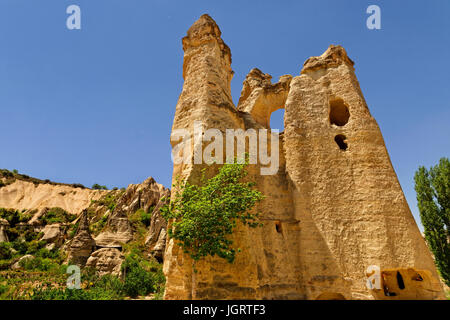 Cave dwellings and 'fairy chimneys' at Goreme National Park, Cappadocia, Turkey. Stock Photo
