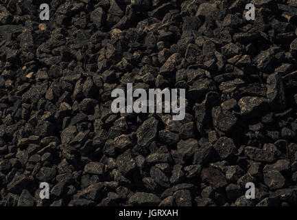 black background of dark stone. The texture is not smooth black stone. Stock Photo