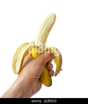 Bright yellow ripe banana in the hand of man, banana with open peel isolated on white Stock Photo