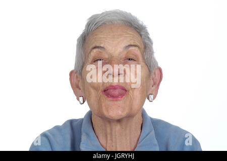 Mature woman sticking out her tongue Stock Photo, Royalty Free Image ...