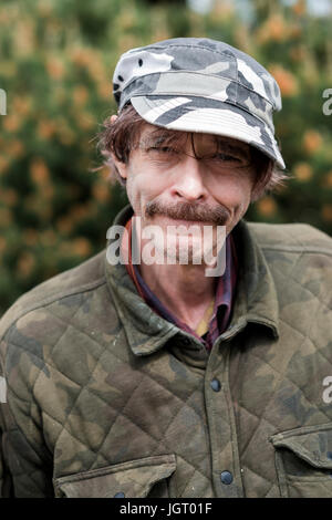 Elderly man with a unique sense of style outdoors for a lifestyle portrai in Oregon. Stock Photo