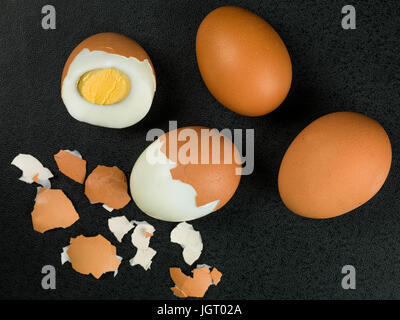 Four Fresh Hard Boiled Eggs Against a Black Background Stock Photo