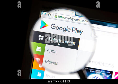Google Play website under a magnifying glass Google Play is a digital distribution platform operated by Google. Stock Photo