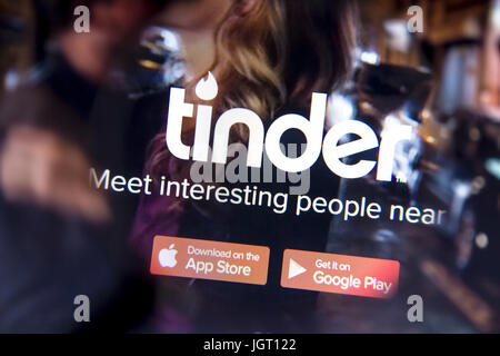 tinder website on a computer screen. Tinder is a location-based dating and social discover Stock Photo