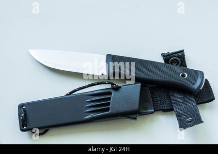 Fix knife for tourism. Plastic case. Knife on white background. Stock Photo