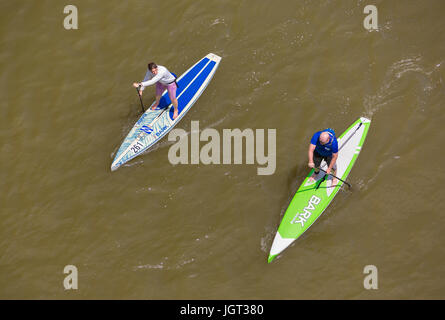 WASHINGTON, DC, USA - Two people paddling their paddleboards on the Potomac River. Stock Photo