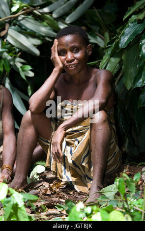 DZANGA-SANHA FOREST RESERVE, CENTRAL AFRICAN REPUBLIC - NOVEMBER 2, 2008: A woman from a tribe of pygmies in the forest. Stock Photo