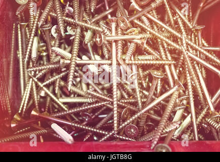 The screws in the red box in the market. Toned. Stock Photo