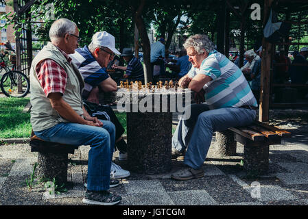 Men playing chess in Union Park (Parcul Unirii) in Alba Iulia city located on the Mures River in Alba County, Transylvania, Romania Stock Photo