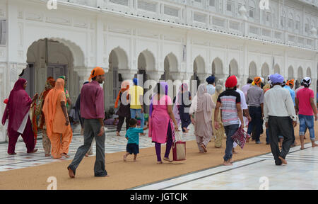 Amritsar, India - Jul 25, 2015. Indian people visit the Golden Temple in Amritsar, India. Stock Photo