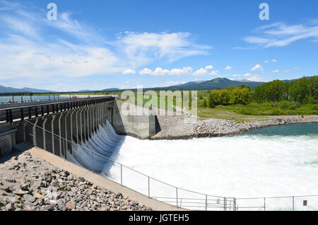 JACKSON HOLE, WYOMING - JUNE 26, 2017: Jackson Lake Dam. Built in 1911 in Grand Teton National Park, it has enlarged the natural lake that is primaril Stock Photo