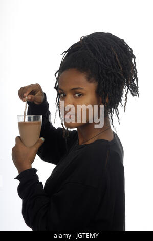 teenage girl drinking milk and chocolate Stock Photo