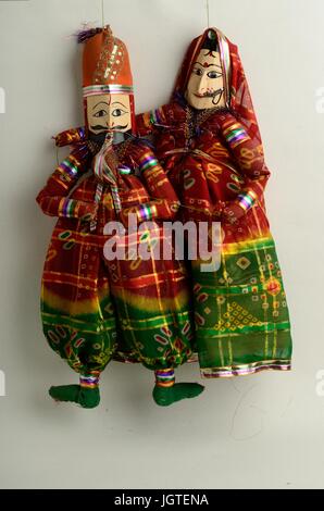 A pair of beautiful, hand made and colorful traditional puppets (Kathaputalies) on white background, Rajasthan, India Stock Photo