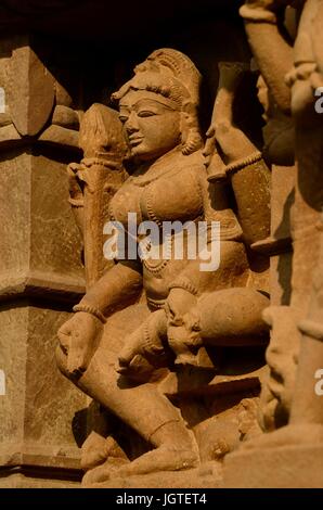 Statue of Goddess Parvati - consort of Lord Shiva. Tucked away, lower right, there is a washed up lion -her vahana, Lakshmana Temple, Khajuraho, India Stock Photo