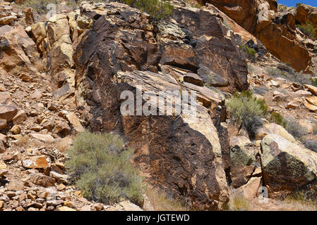 PAROWAN, UTAH - JUNE 29, 2017: Parowan Gap petroglyphs. At the edge of the dry Little Salt Lake, lies a natural gap in the mountains, covered with hun Stock Photo