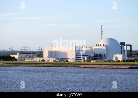 Riverside view of Brokdorf Nuclear Power Plant. It started in October 1986 and the decommissioning is planned for 2021. Stock Photo